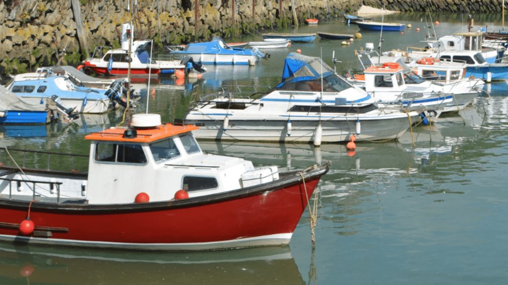 various fishing boats docked in a UK harbour